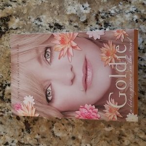 Goldie a lotus grows in the mud Paperback Book